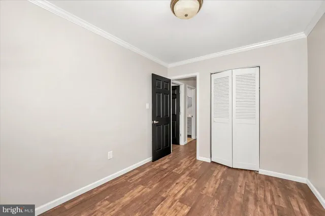 a view of hallway with wooden floor