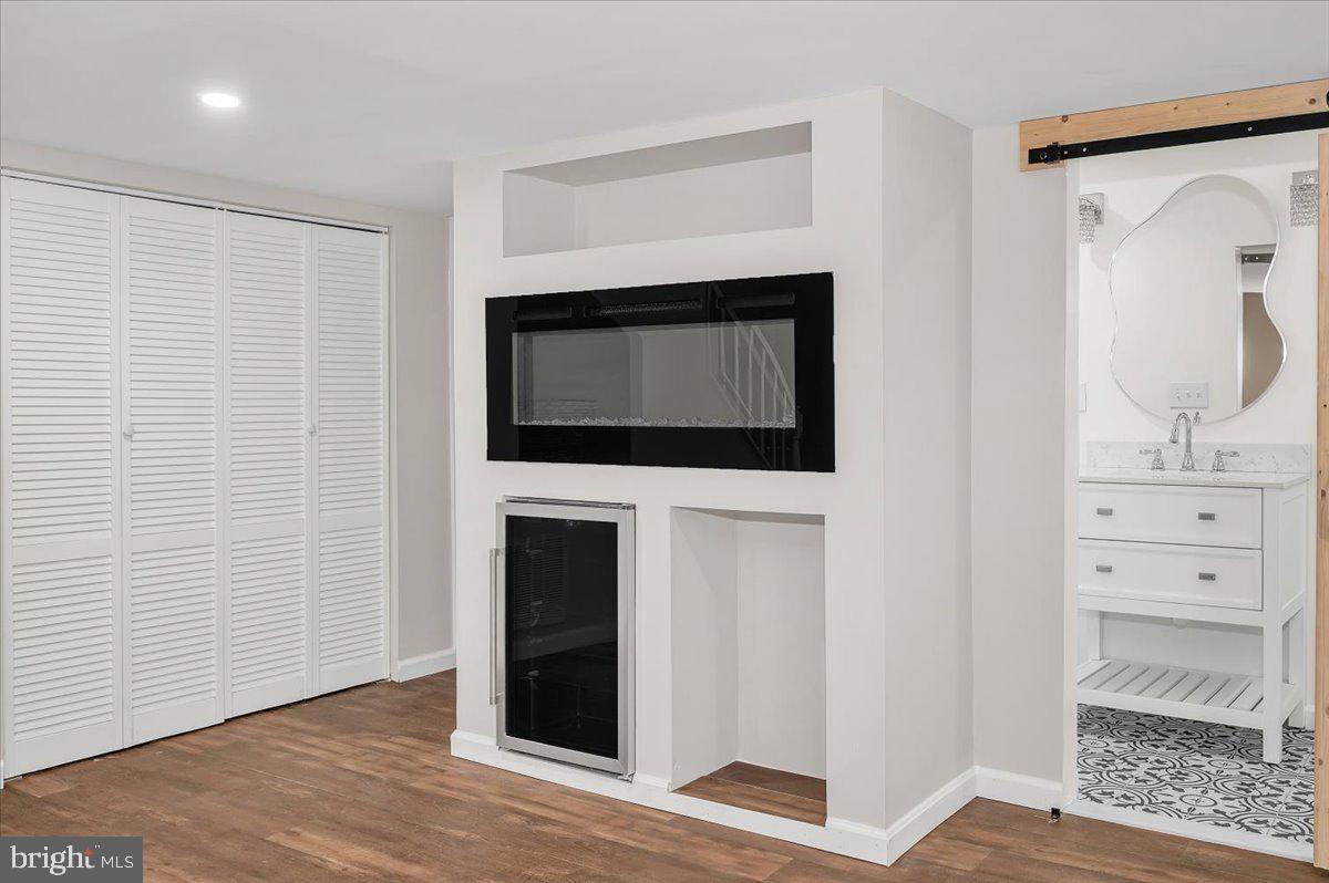 140 Gold Kettle Drive Gaithersburg, MD 20878 - Photo 23 of 35 a living room with a fireplace and a walk in closet