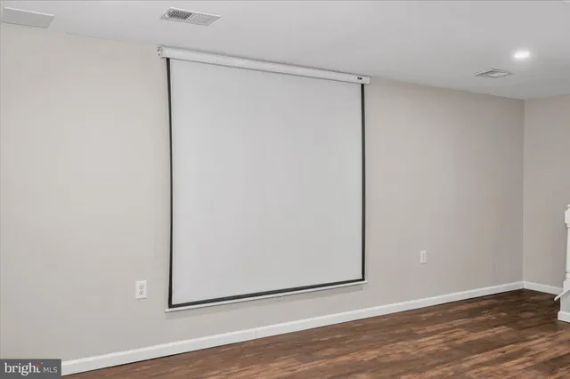 a view of a small space with wooden floor