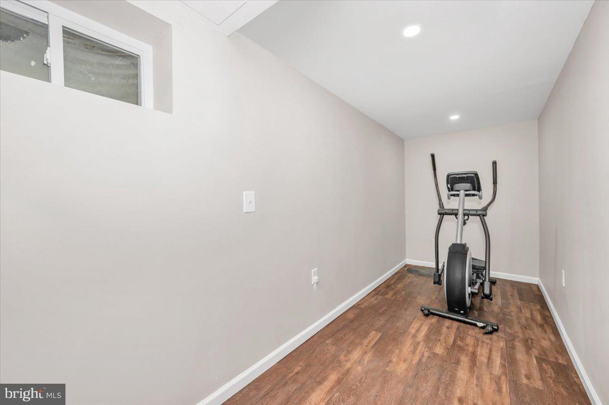 140 Gold Kettle Drive Gaithersburg, MD 20878 - Photo 29 of 35 a view of a room with wooden floor and a ceiling fan