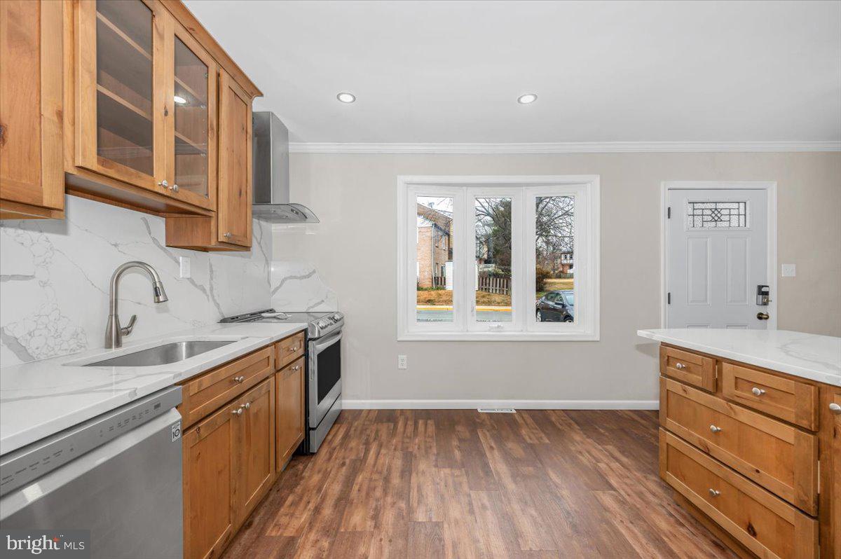 140 Gold Kettle Drive Gaithersburg, MD 20878 - Photo 9 of 35 a kitchen with stainless steel appliances granite countertop a sink stove and cabinets