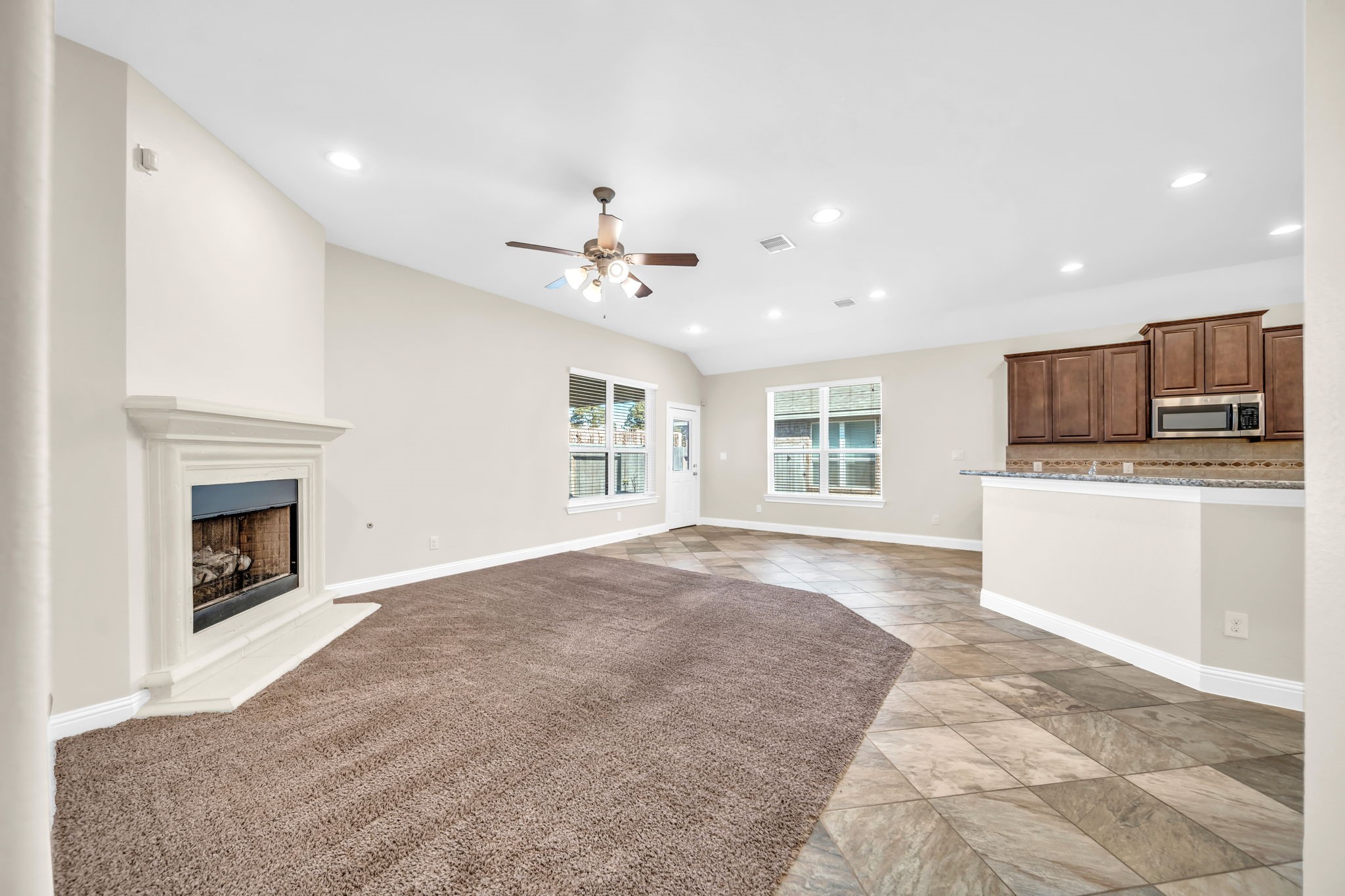 19043 Minero Lane Montgomery, TX 77356 - Photo 10 of 26 Open living room with gas log fireplace.