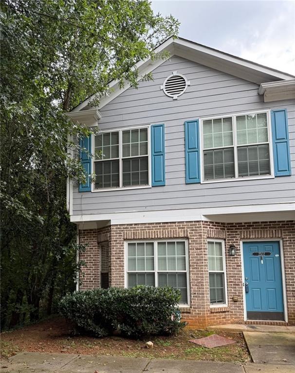 2502 Walden Lake Drive Decatur, GA 30035 - Photo 1 of 8 a front view of a house with garden
