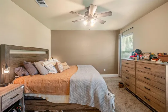 a bathroom with a granite countertop sink and a mirror with toilet