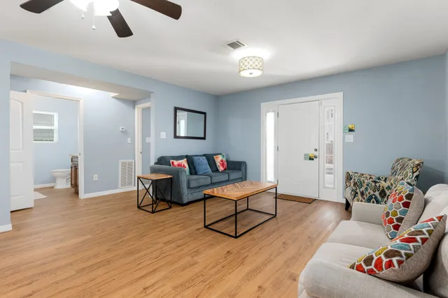 a view of a dining room with furniture and wooden floor