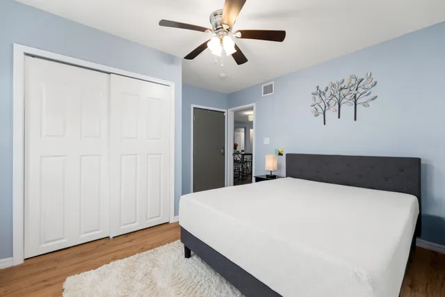 a bedroom with a large bed and a window