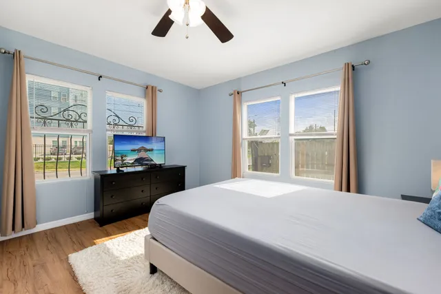 a bathroom with a granite countertop toilet a sink and a mirror
