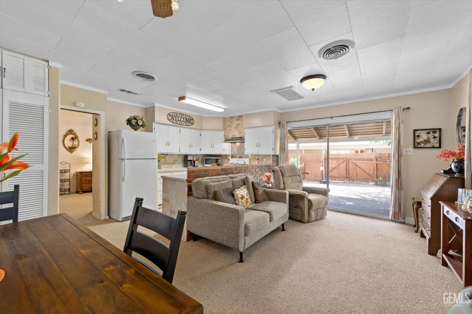 Undisclosed Address Taft, CA 93268 - Photo 17 of 44 a living room with furniture and a flat screen tv