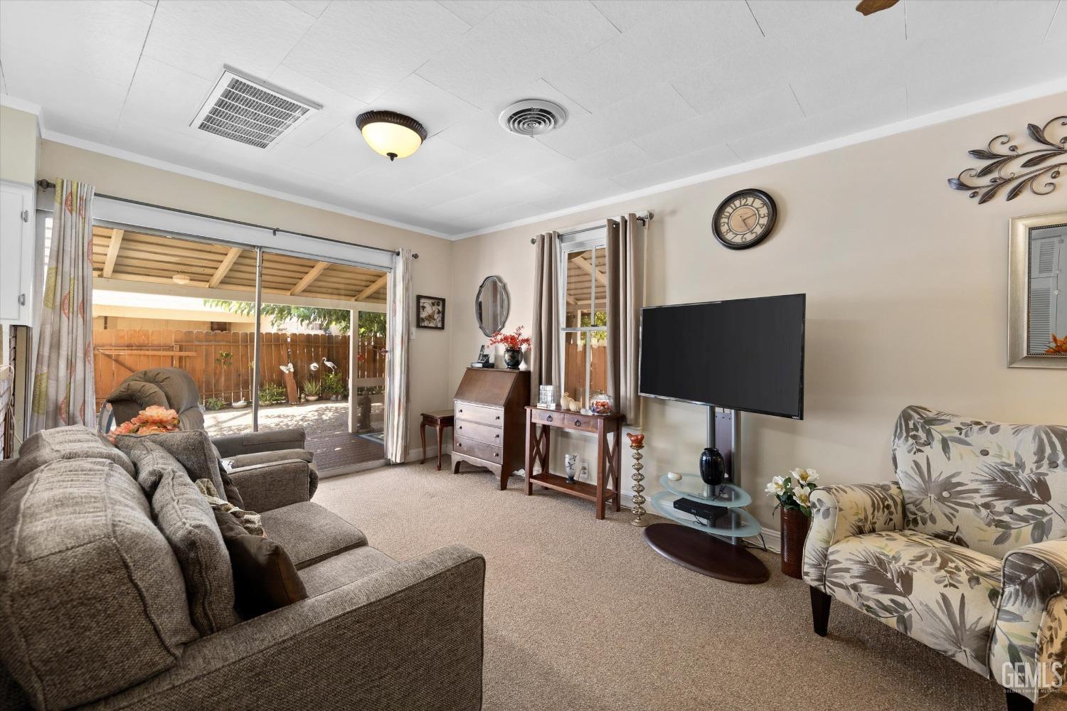 Undisclosed Address Taft, CA 93268 - Photo 18 of 44 a living room with furniture and a flat screen tv