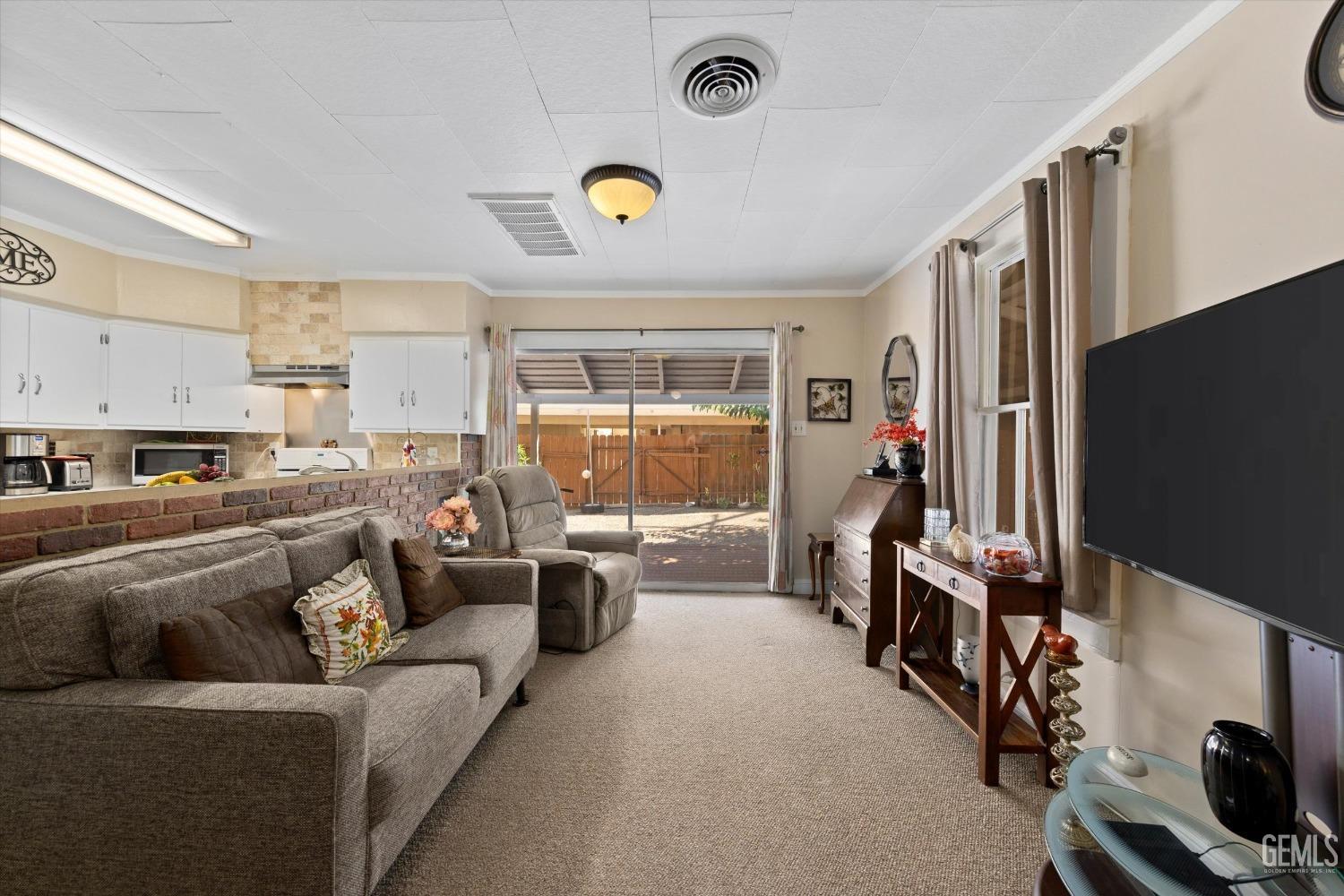 Undisclosed Address Taft, CA 93268 - Photo 19 of 44 a living room with furniture and a flat screen tv