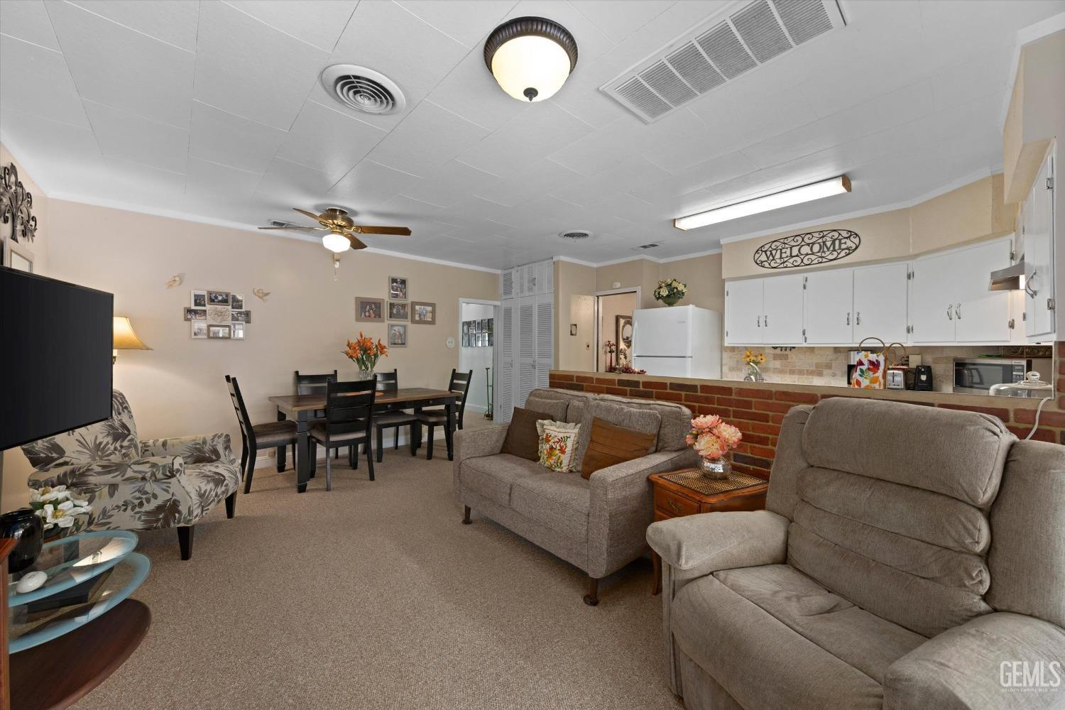 Undisclosed Address Taft, CA 93268 - Photo 20 of 44 a living room with furniture and a flat screen tv