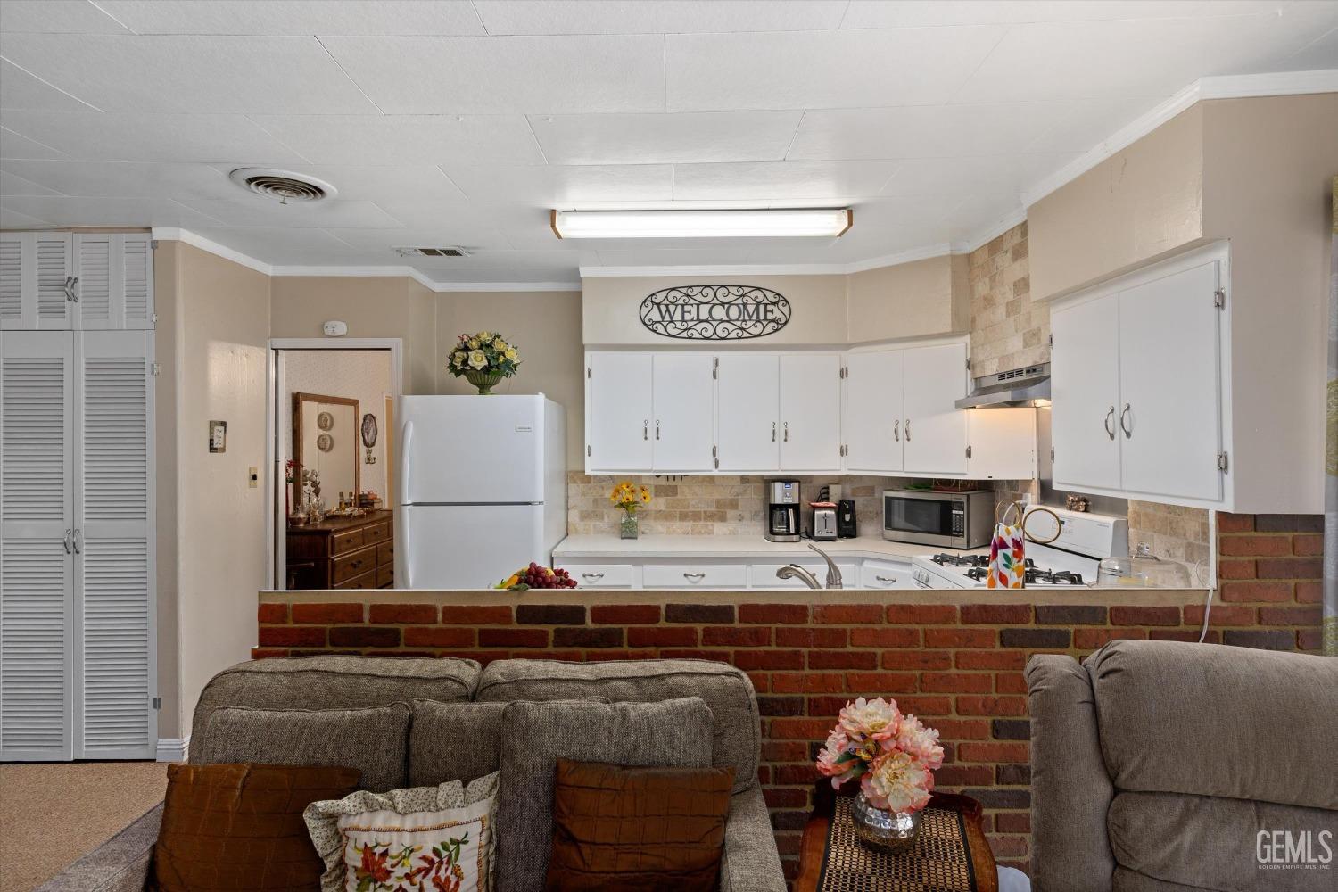 Undisclosed Address Taft, CA 93268 - Photo 21 of 44 a living room with furniture and kitchen view