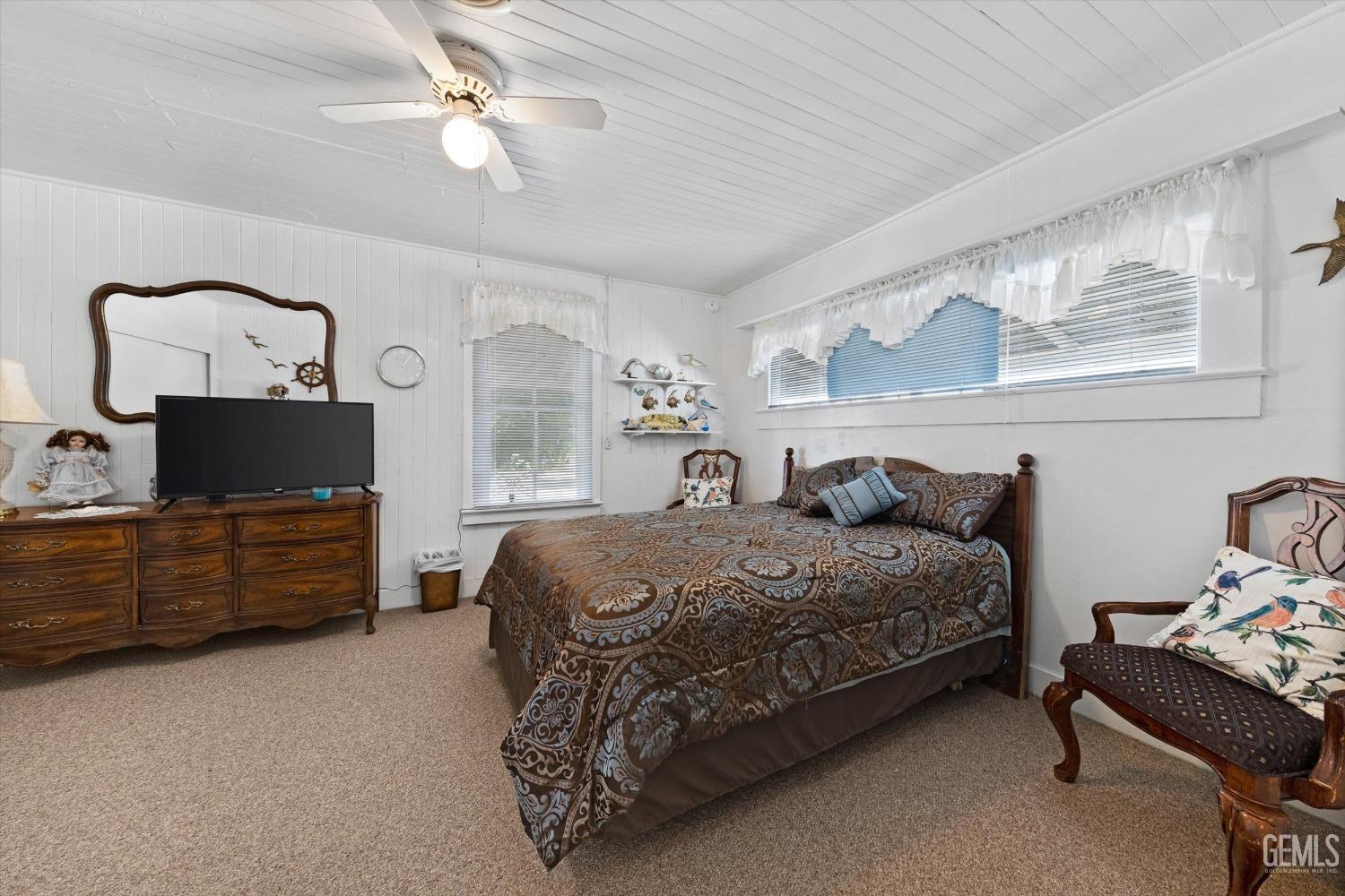 Undisclosed Address Taft, CA 93268 - Photo 24 of 44 a bedroom with a bed and a television