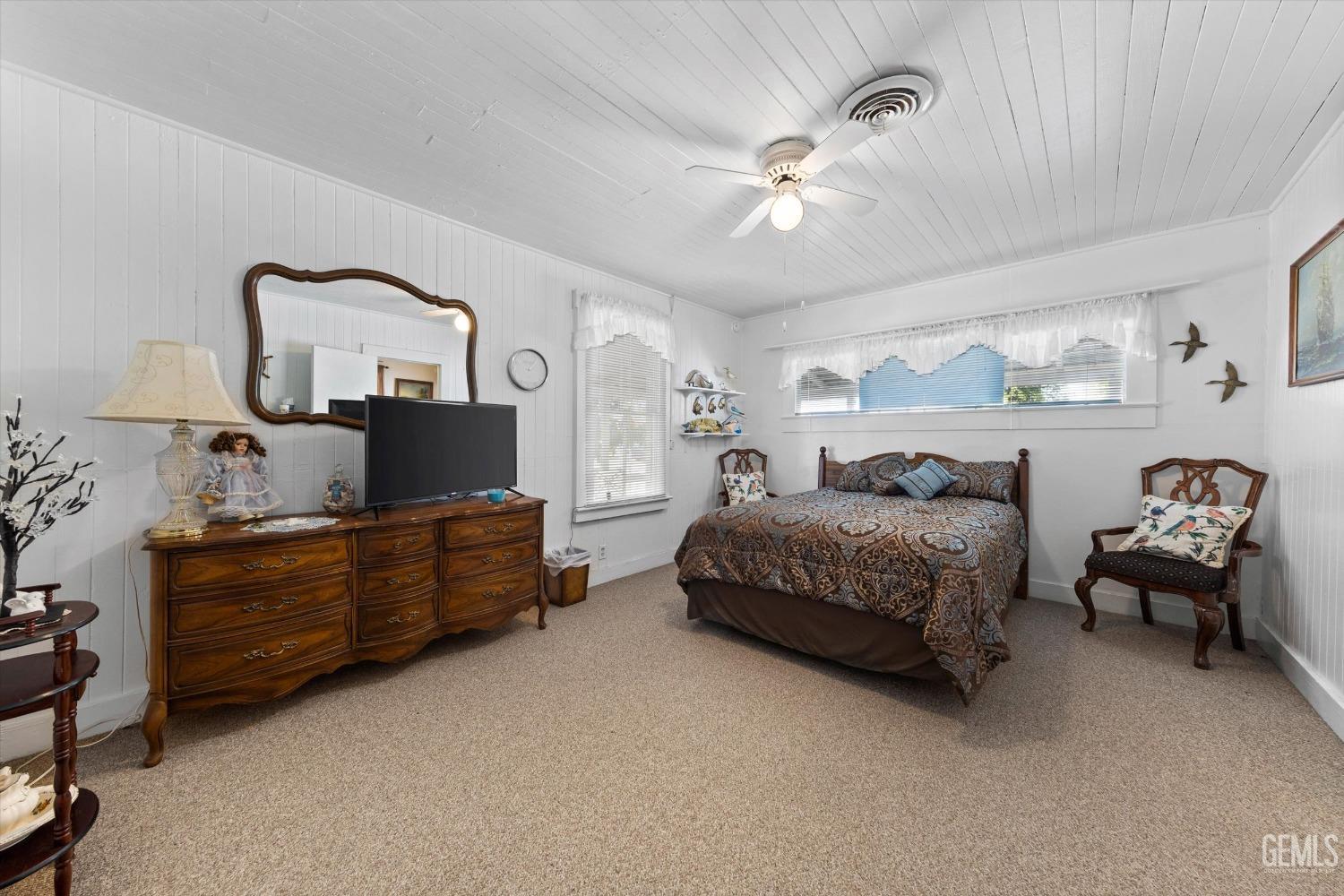 Undisclosed Address Taft, CA 93268 - Photo 25 of 44 a bedroom with a bed and a chandelier