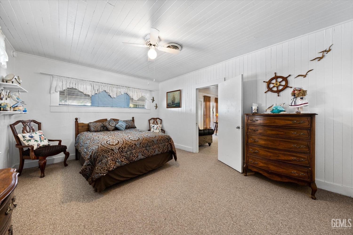 Undisclosed Address Taft, CA 93268 - Photo 26 of 44 a bedroom with a bed and a chandelier