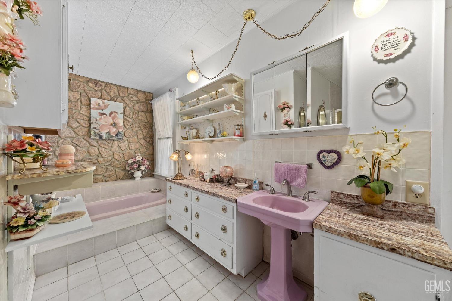 Undisclosed Address Taft, CA 93268 - Photo 27 of 44 a bathroom with a sink a vanity and a bathtub