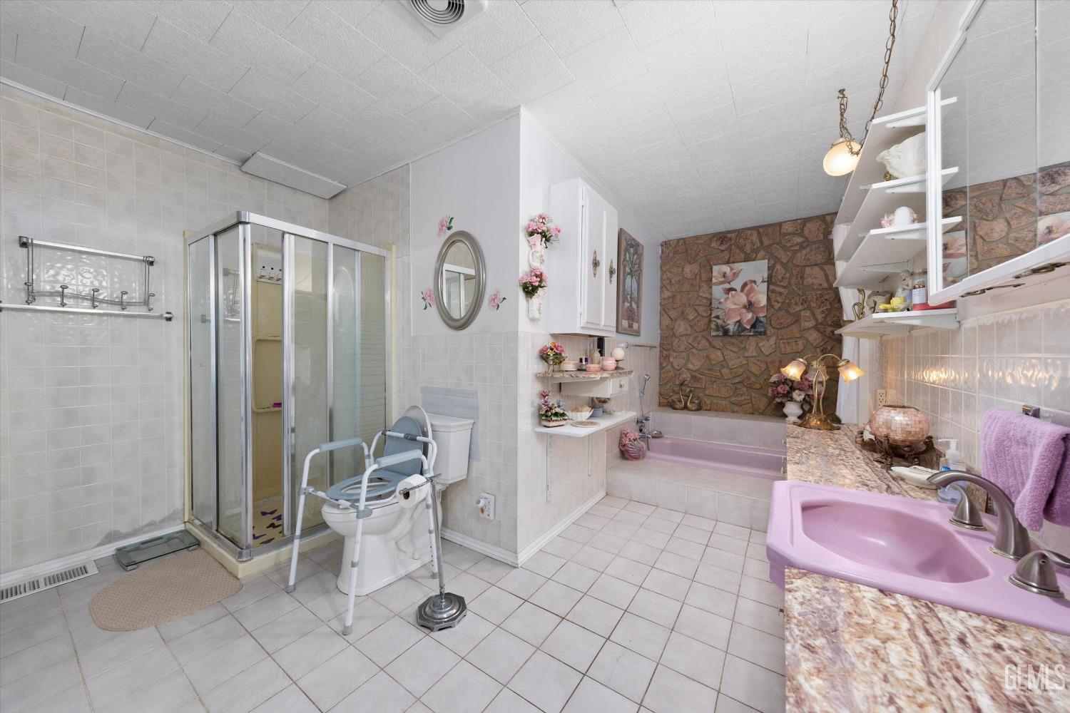 Undisclosed Address Taft, CA 93268 - Photo 28 of 44 a spacious bathroom with a mirror and shower