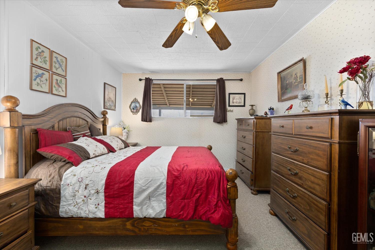 Undisclosed Address Taft, CA 93268 - Photo 30 of 44 a bedroom with a bed and dresser with mirror