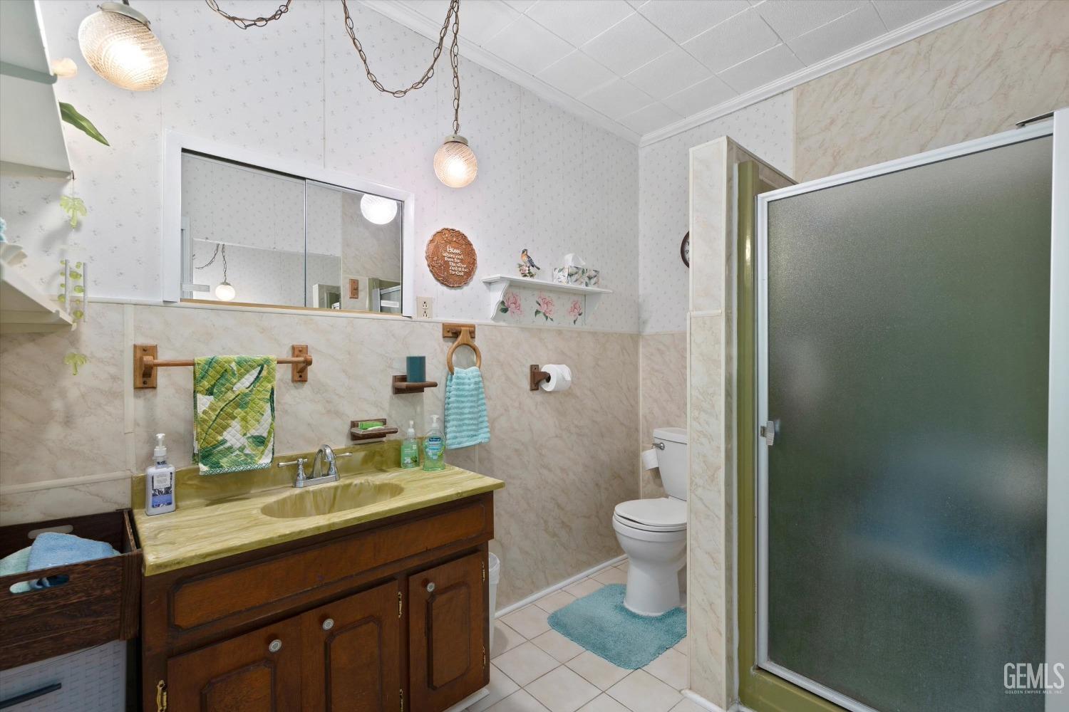 Undisclosed Address Taft, CA 93268 - Photo 33 of 44 a bathroom with a granite countertop sink toilet and shower