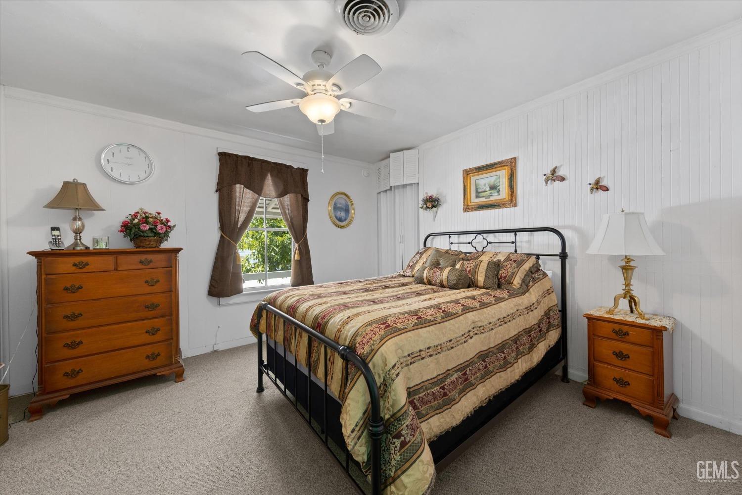 Undisclosed Address Taft, CA 93268 - Photo 34 of 44 a bedroom with a bed and a dresser