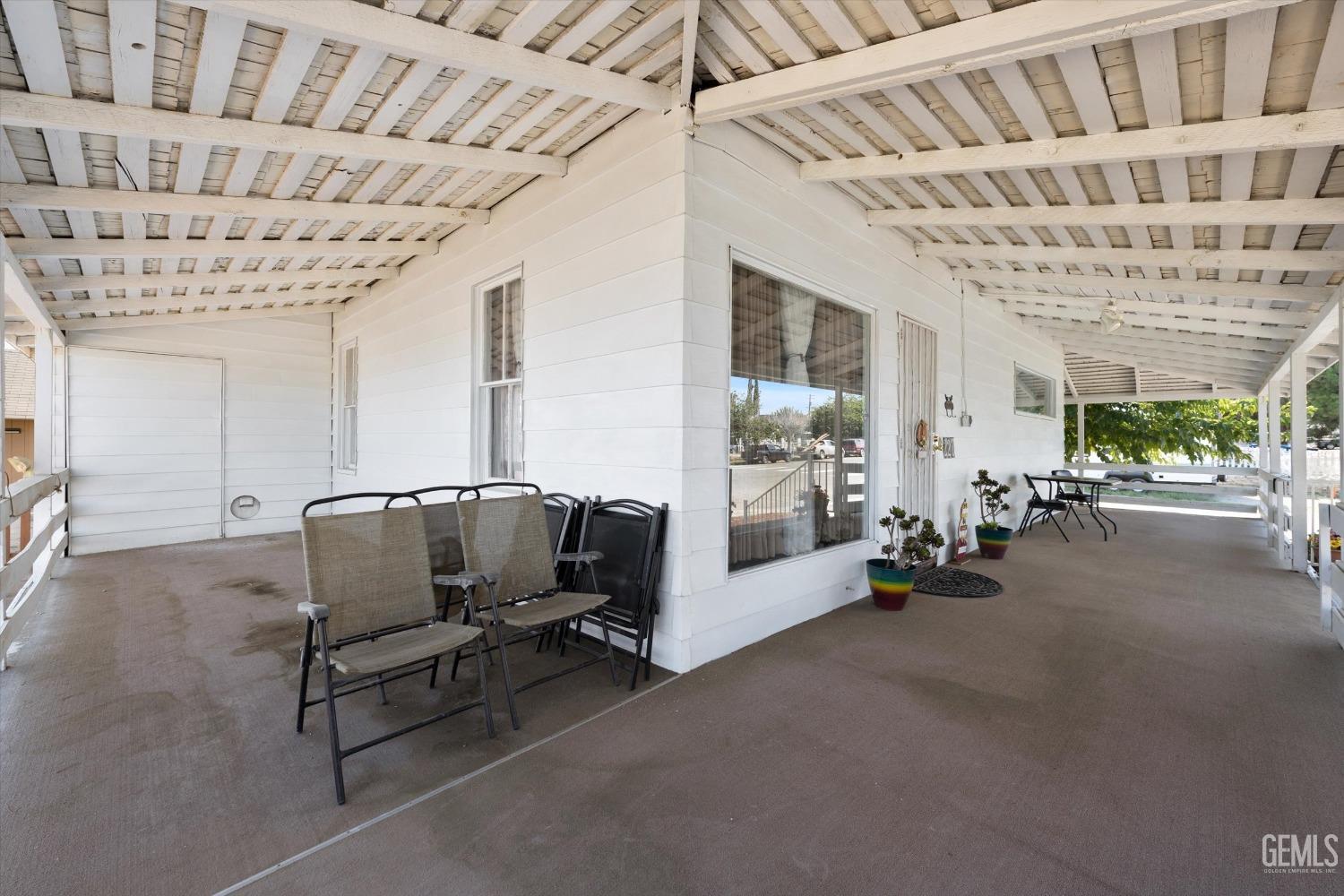 Undisclosed Address Taft, CA 93268 - Photo 6 of 44 a living room with furniture and a chandelier