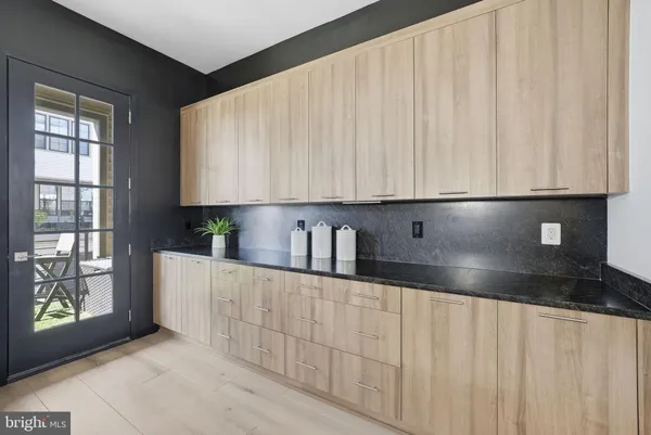 a kitchen with kitchen island stainless steel appliances a sink stove and refrigerator