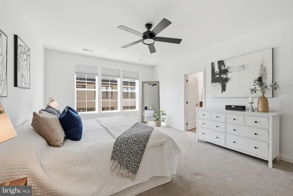 a view of a hallway with wooden floor and entryway