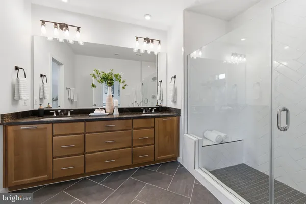 a bedroom with a bed and ceiling fan