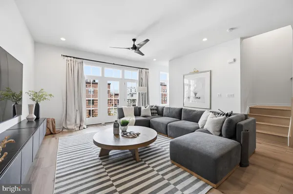 a living room with furniture and a table