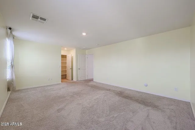 a bathroom with a double vanity sink mirror and toilet