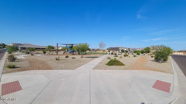 a view of a patio with table and chairs with wooden floor and fence