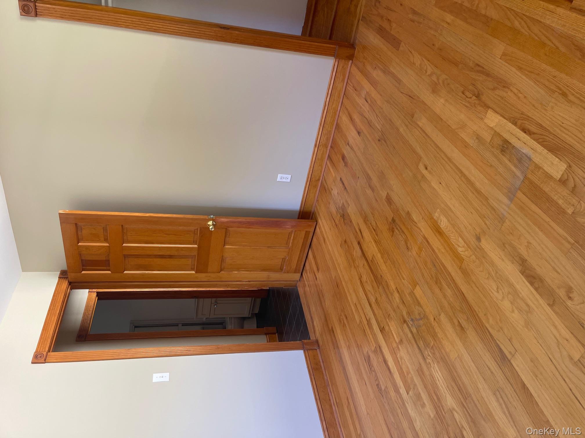 57 Ashland Street, Unit 2 New Rochelle, NY 10801 - Photo 15 of 19 Unfurnished room featuring wood finished floors and baseboards