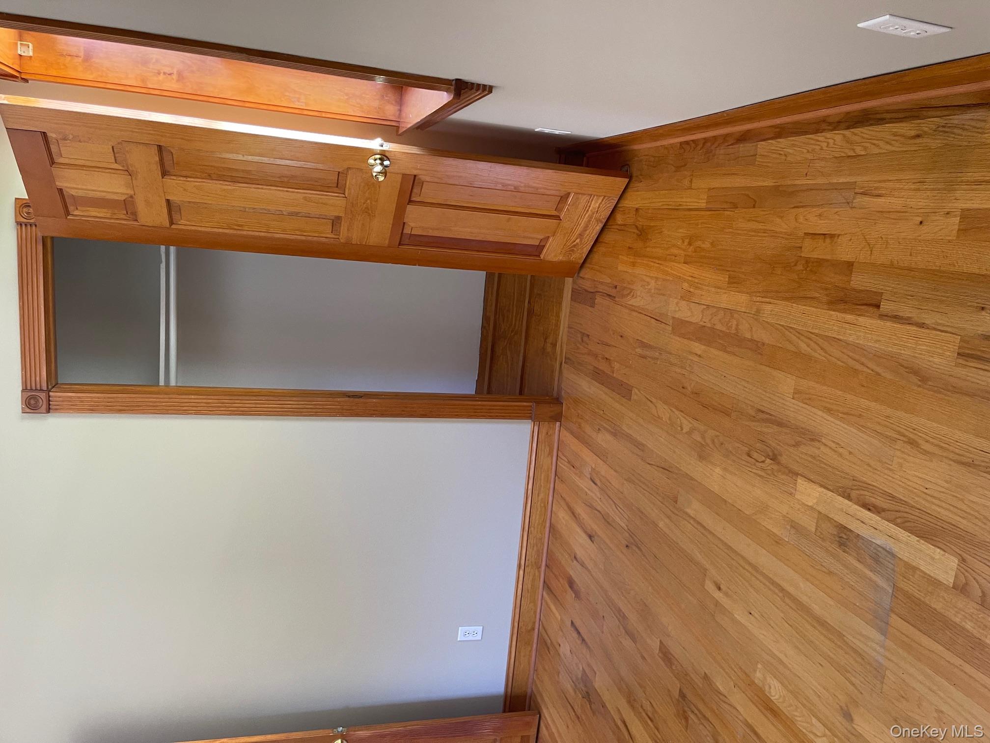 57 Ashland Street, Unit 2 New Rochelle, NY 10801 - Photo 16 of 19 Unfurnished bedroom with light wood-style floors and a closet