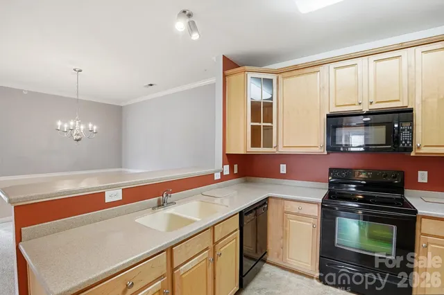 a kitchen with a refrigerator stove and microwave