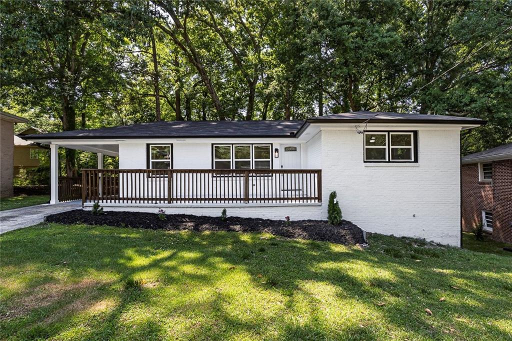 202 Oakcliff Court Northwest Atlanta, GA 30331 - Photo 1 of 27 a house view with a garden space