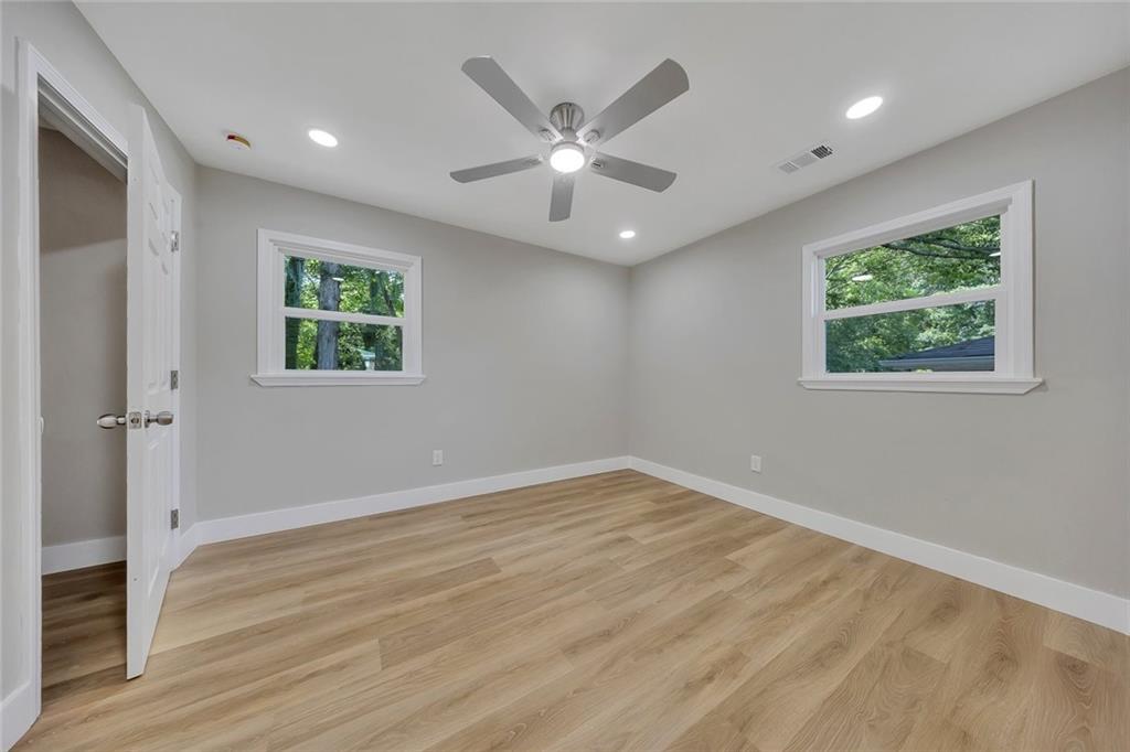 202 Oakcliff Court Northwest Atlanta, GA 30331 - Photo 11 of 27 a view of an empty room with wooden floor and a window