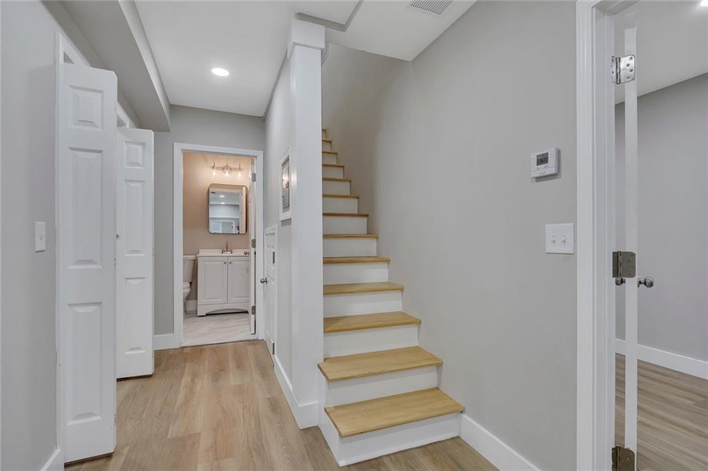 202 Oakcliff Court Northwest Atlanta, GA 30331 - Photo 15 of 27 a view of entryway with wooden floor and stairs
