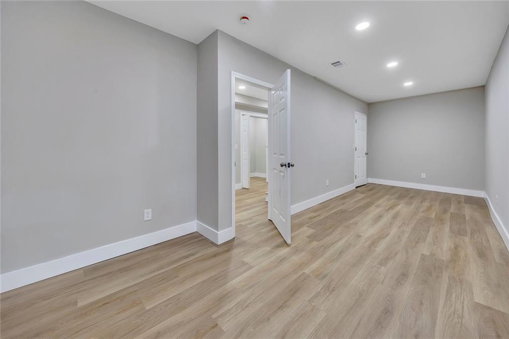 202 Oakcliff Court Northwest Atlanta, GA 30331 - Photo 18 of 27 a view of empty room with wooden floor