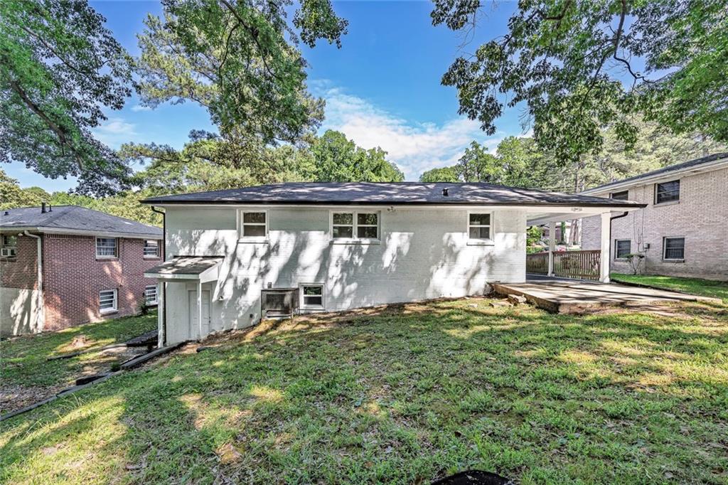 202 Oakcliff Court Northwest Atlanta, GA 30331 - Photo 26 of 27 a view of a house with backyard and sitting area