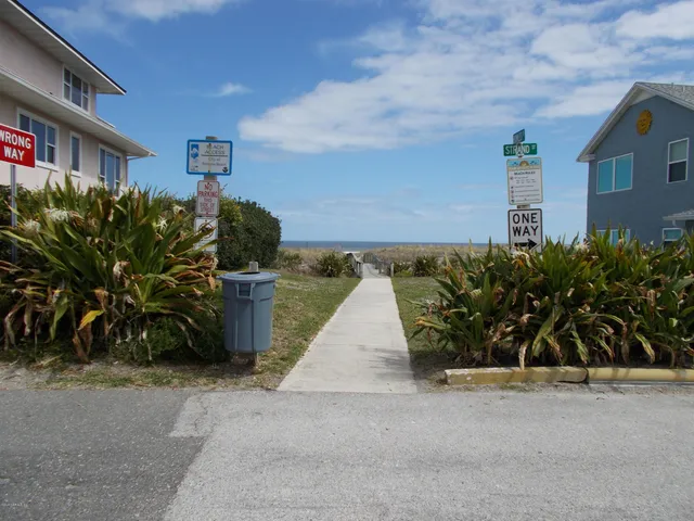 a view of a street with plants