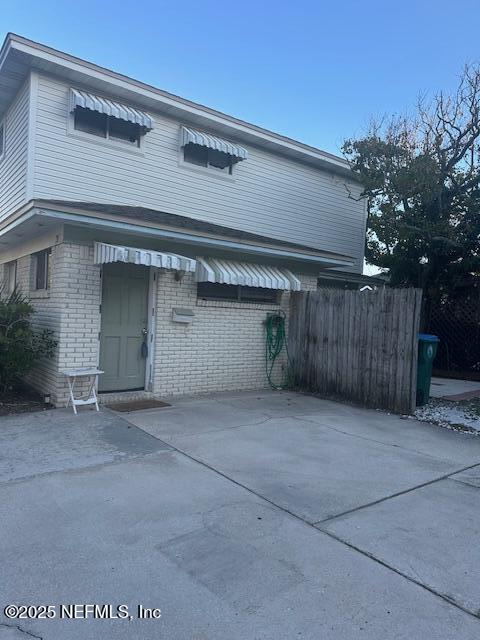 1500 First Street, Unit B Neptune Beach, FL 32266 - Photo 2 of 13 front view of a house with a garage