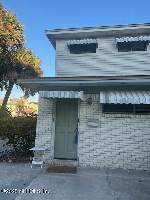 1500 First Street, Unit B Neptune Beach, FL 32266 - Photo 4 of 13 a front view of a house with a yard