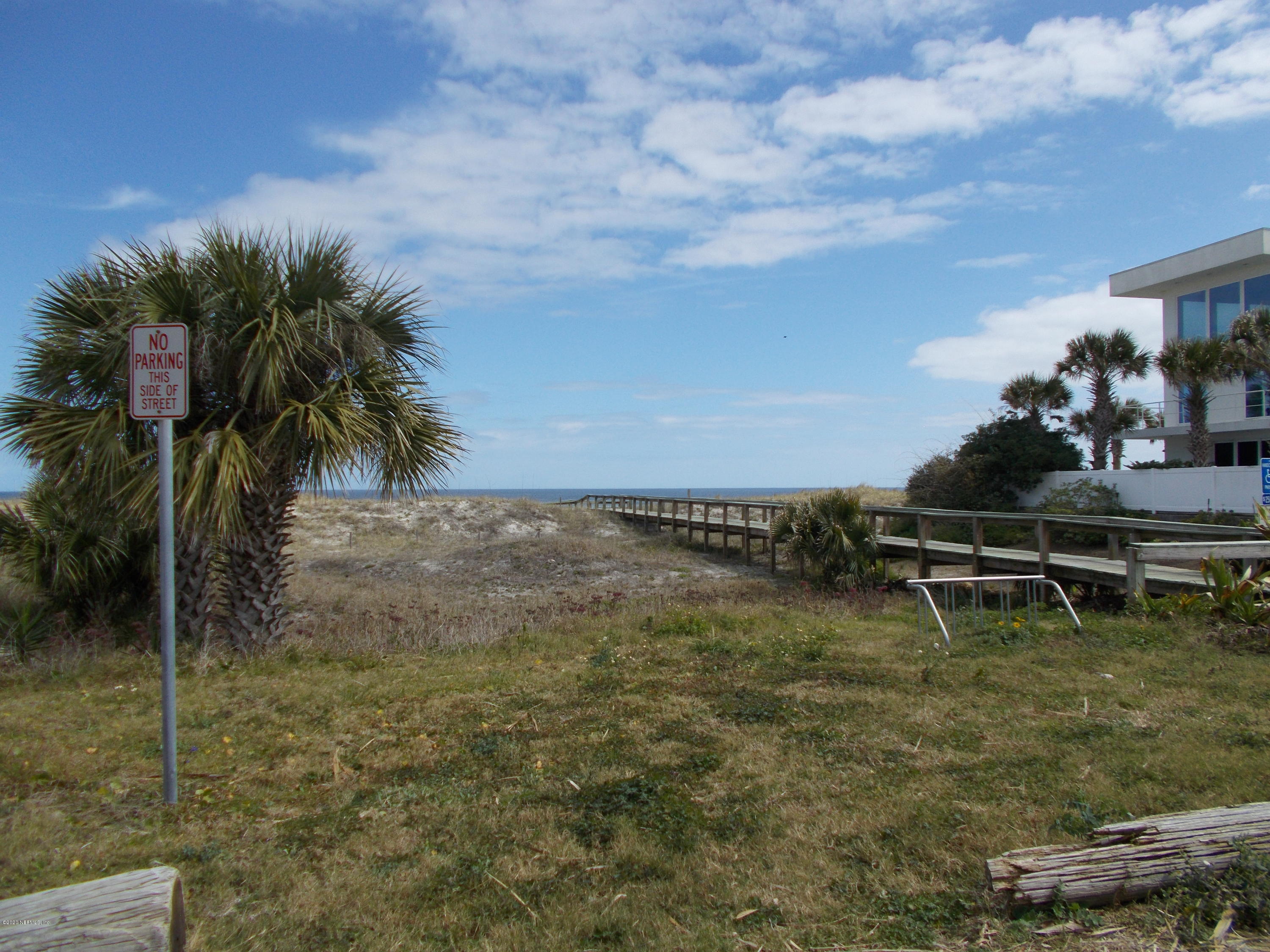 1500 First Street, Unit B Neptune Beach, FL 32266 - Photo 9 of 13 a backyard of a house with table and chairs