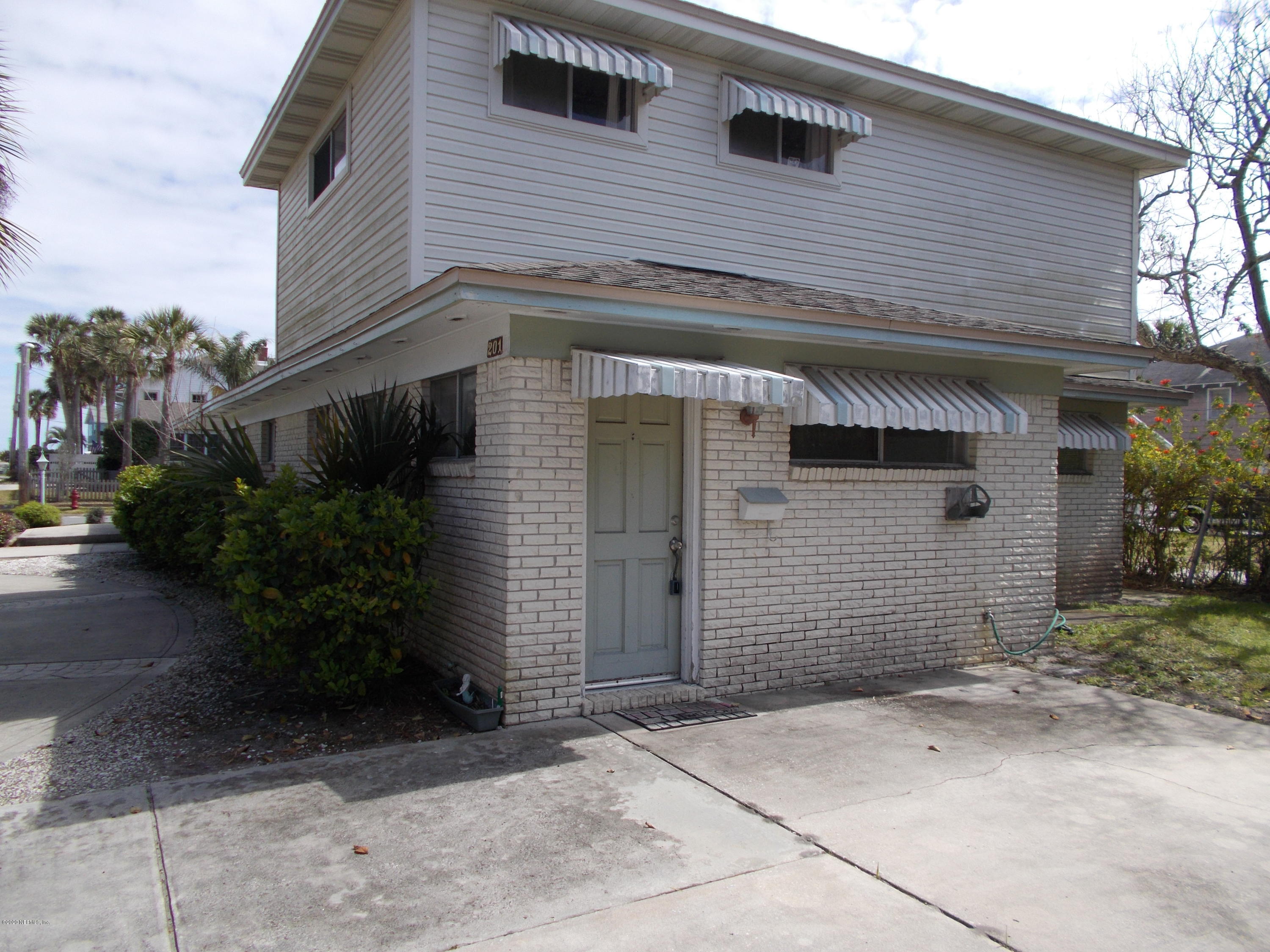 1500 First Street, Unit B Neptune Beach, FL 32266 - Photo 10 of 13 a front view of a house with garden