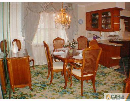 36 Mageira Street South River, NJ 08882 - Photo 3 of 10 a dining room with furniture and chandelier