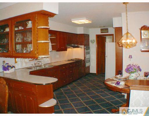 36 Mageira Street South River, NJ 08882 - Photo 4 of 10 a bathroom with a sink and a mirror