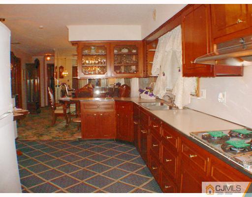 36 Mageira Street South River, NJ 08882 - Photo 5 of 10 a large kitchen with stainless steel appliances a sink and cabinets