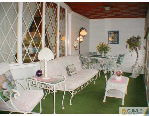 36 Mageira Street South River, NJ 08882 - Photo 6 of 10 view of living room with furniture and a table