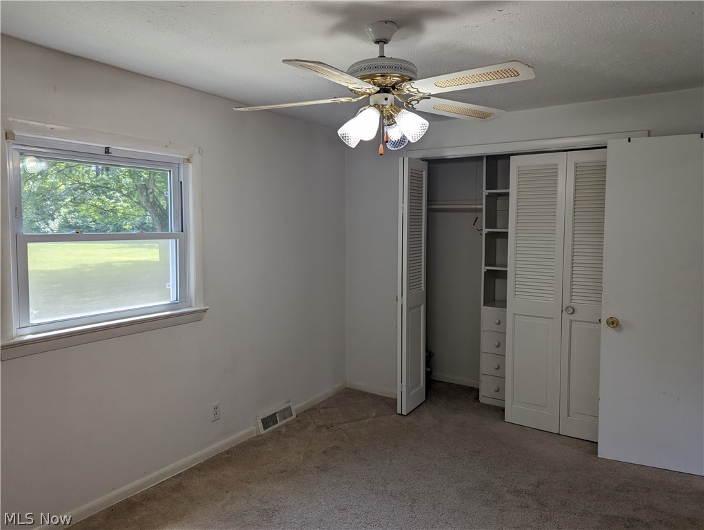 8127 Cedar Road Chesterland, OH 44026 - Photo 8 of 36 Carpeted, featuring ceiling fan and closet