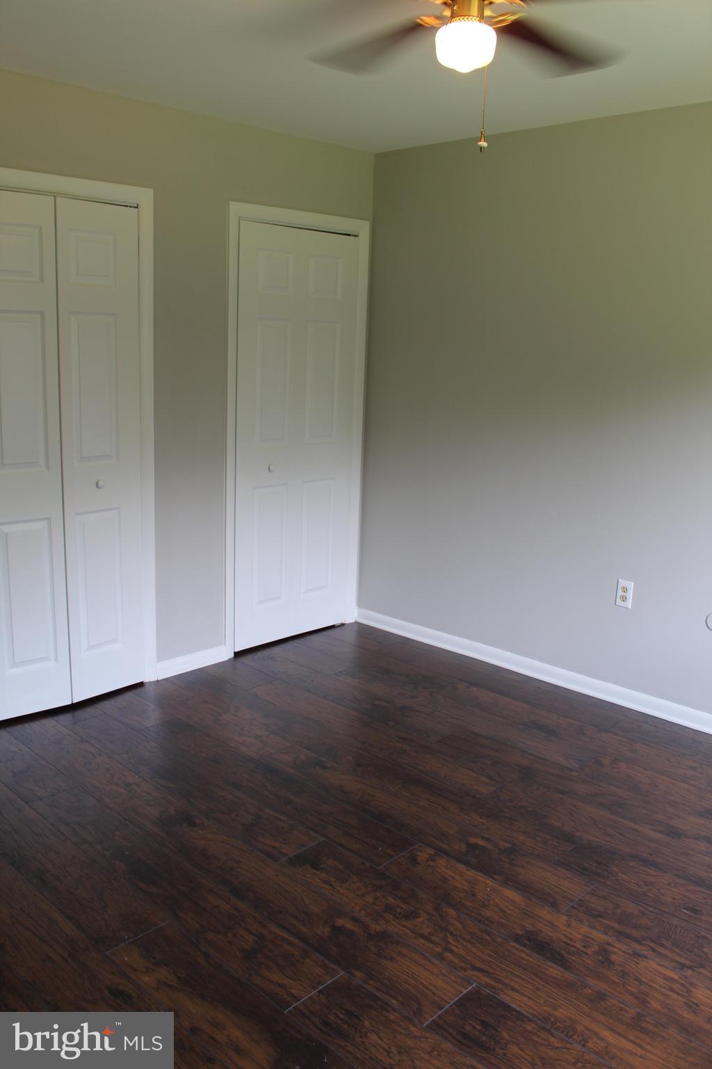 110 Griffith Road, Unit 2 Delta, PA 17314 - Photo 4 of 6 a view of an empty room with wooden floor